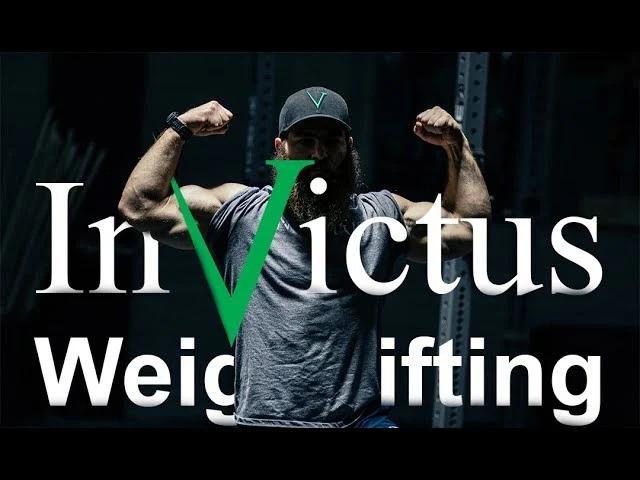 Coach Jared in front of an Invictus Weightlifting logo on an article on the benefits of CrossFitters wearing weightlifting shoes.